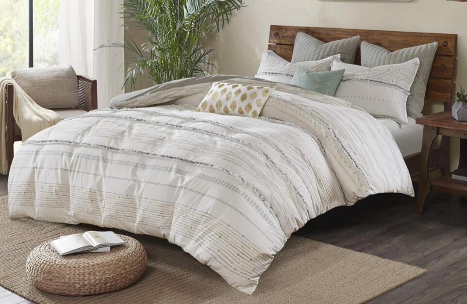 Neutral cotton jacquard comforter set with soft woven stripes and eyelash texture on a light oak bedframe, styled in a cozy boho farmhouse bedroom.
