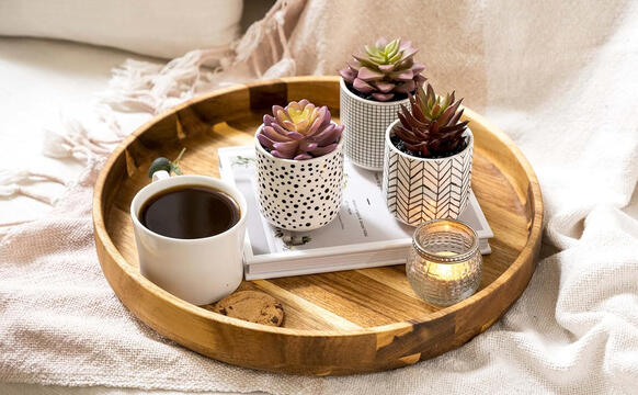 Acacia wood serving tray with warm grain and smooth edges.