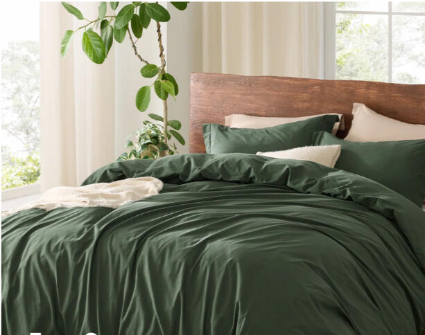 Cotton duvet on walnut bedframe in a cozy mid-century modern bedroom”
