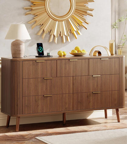 Mid-century style dresser with fluted wood design, brass handles, and seven spacious drawers. Features USB and USB-C charging ports with warm natural finish suitable for both walnut and oak bedrooms.