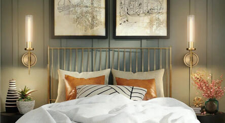 Brass and glass wall sconce with striped glass shade and warm golden finish. Mounted against dark green wall for cozy ambient bedroom lighting. Elegant mid-century inspired design with soft, diffused glow.